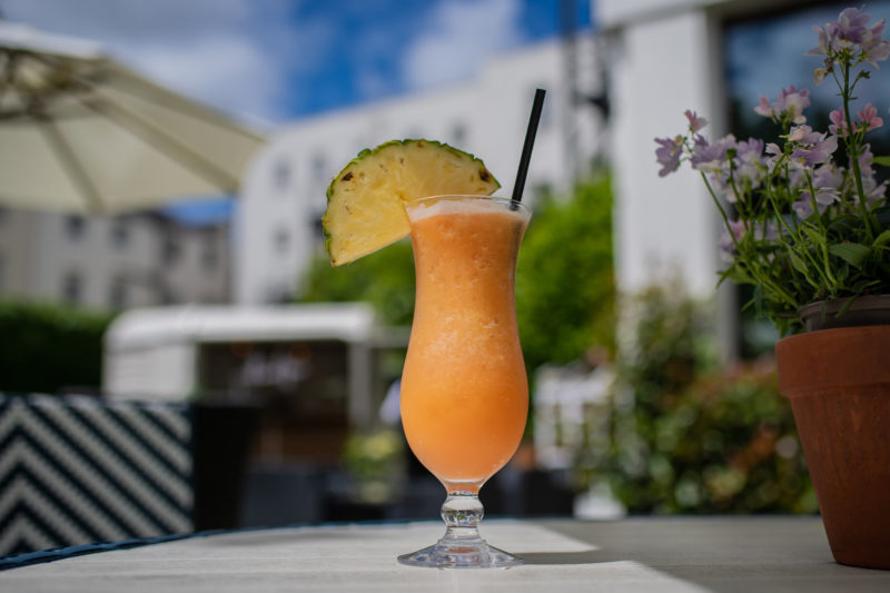 Tropical cocktail summer garden The Queens Hotel