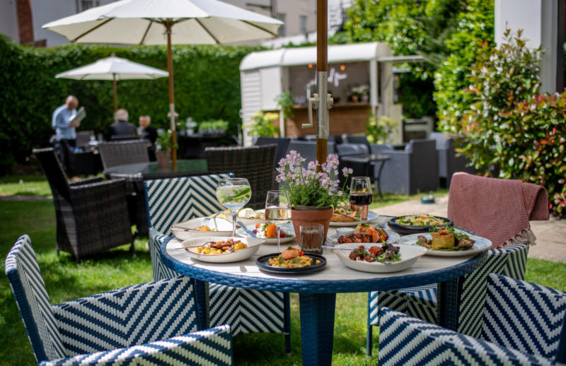 Food and drinks on table summer garden