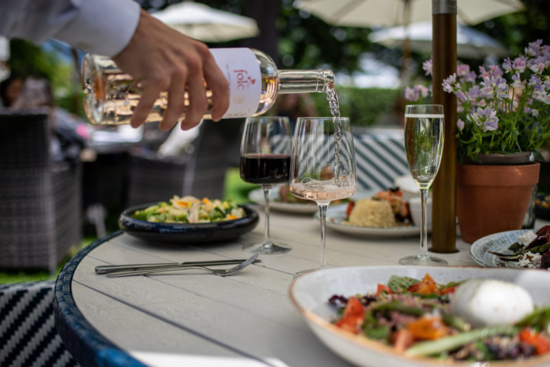 Wine being poured summer garden The Queens Hotel