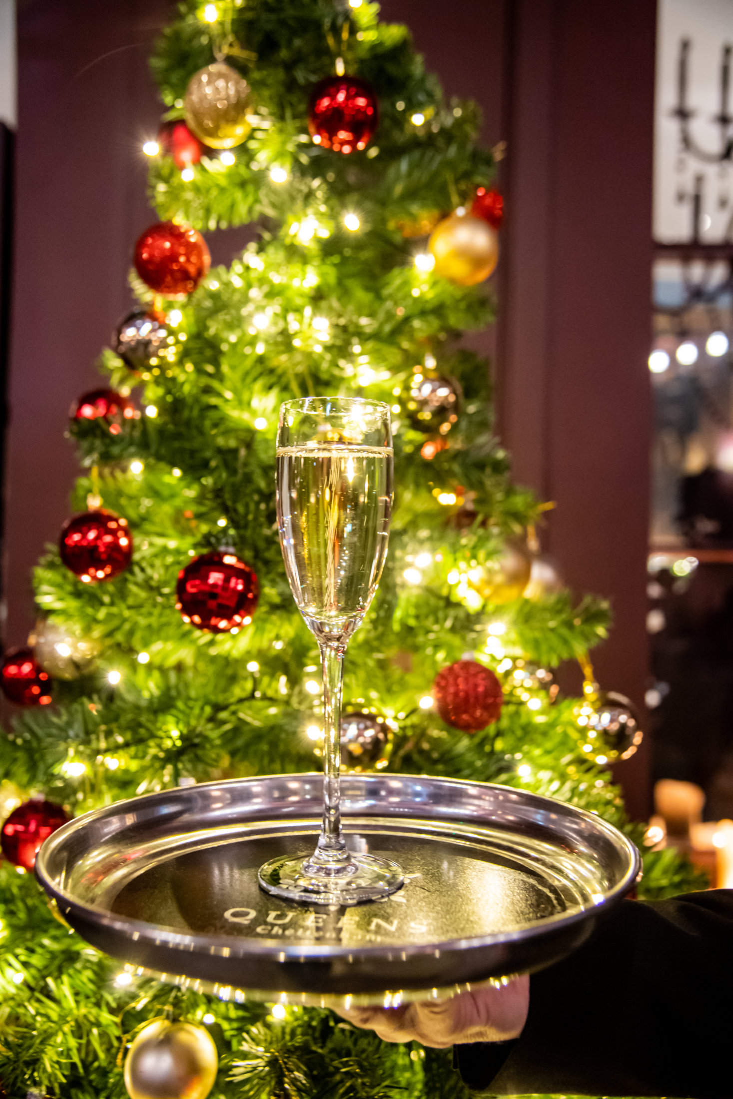 Champagne glass by Christmas tree Victoria's Cheltenham