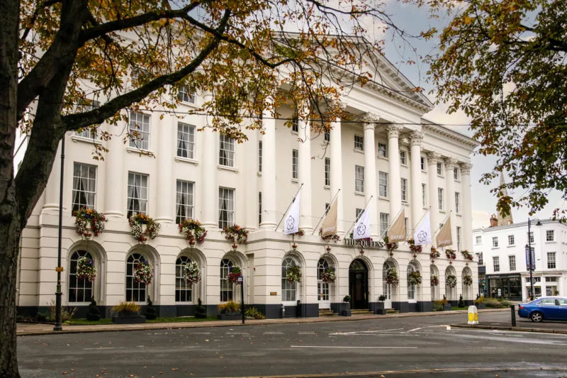 Queens Hotel Exterior image with SHC flags