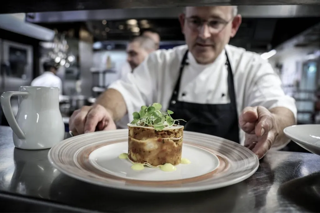 The Queens Hotel chef presenting a starter