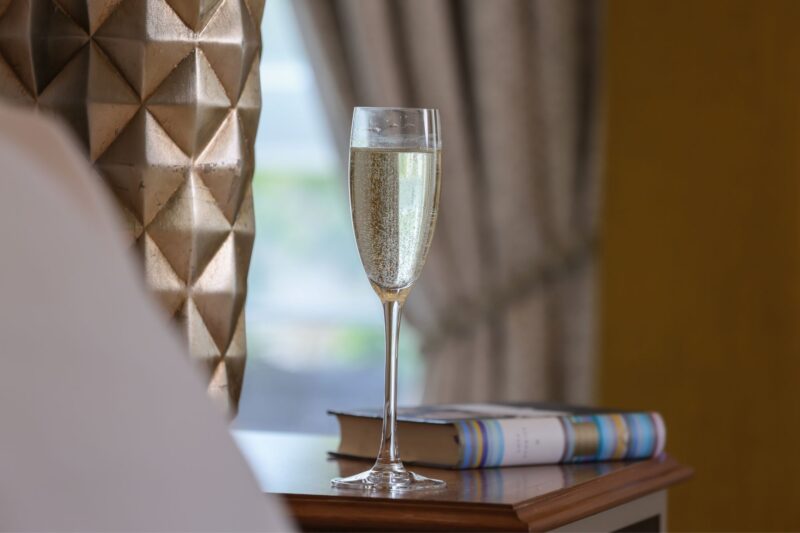 The Queens Hotel Cheltenham Prosecco next to the bed close up