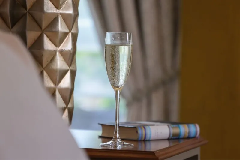 The Queens Hotel Cheltenham Prosecco next to the bed close up