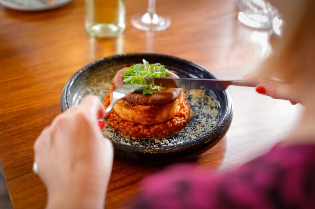 The Queens Hotel Cheltenham smoked cheese souffle being cut